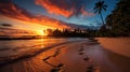 Tranquil sunset beach with waves and footprints in the sand serene coastal scene Royalty Free Stock Photo