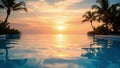Tranquil sunset over infinity pool reflecting sky and palm trees on tropical vacation Royalty Free Stock Photo