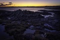 Tranquil sunset scene on rocky beach, on west coast of Scotland Royalty Free Stock Photo