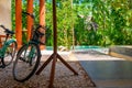 Tranquil swimming pool with trees and bicycles at luxury hotel resort