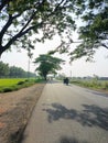 Tranquil Trails: Journey Along the Enchanting Village Road Royalty Free Stock Photo