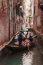 Tranquil Venice canal with solitary gondola - serene, timeless, and picturesque Italian scene.