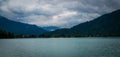 Tranquil view of the cloudy sky over Tegernsee Lake and the mountains. Germany.