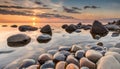 Tranquil view of sunset with stones the water. On shore of the Baltic Sea in Estonia.