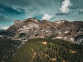 Tranquil view of the Swiss Alps in Avers, with autumn trees and grass in the valley