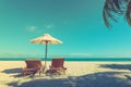 Beautiful beach. Chairs under palm trees sandy beach sea. Summer holiday and vacation concept for tourism. Inspirational beach Royalty Free Stock Photo