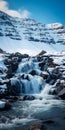 Tranquil Waterfall Surrounded By Snow Peaks And Mountains