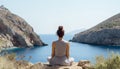 Tranquil woman engrossed in mindful yoga practice amidst the picturesque seashore view