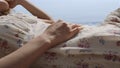 Tranquil woman napping beach covering head with hat closeup. Girl lying seacoast Royalty Free Stock Photo