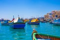 Tranquil world of colorful fisher boats at Marsaxlokk at Malta