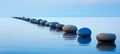 Tranquil zen concept serene blue step stones in calm water for mindful meditation and relaxation Royalty Free Stock Photo