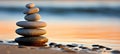 Tranquil zen stones resting on smooth sand beach in serene natural setting Royalty Free Stock Photo