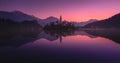 Tranquility Winter Rising Of The Sun At Lake Bled, Slovenia.Windless Reflection Church of Mary the Queen, Parish Church Of St.Mar