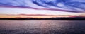 Tranquill peaceful red coloured cirrus cloud, sunset seascape.