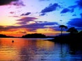 Sunset Canoe: Tranquillity and peace background at a power-full color-full sunset with canoe