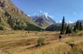 Trans-Ili Alatau mountain range of the Tien Shan system in Kazakhstan near the city of Almaty. Rocky peaks covered with snow and g Royalty Free Stock Photo