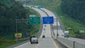 Trans Java toll road KM 443 at noon. There are signs for directions to the cities of Ambarawa, Magelang, Semarang, Ungaran, Bawen