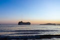 Transatlantic leaving the port of Santos during sunset Royalty Free Stock Photo