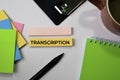 Transcription text on sticky notes with office desk concept