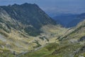 Transfagarasan - High altitude winding road in Carpathians mountains panorama. Aerial view. Royalty Free Stock Photo