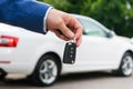 Transfer of a car to a new owner for money, ignition keys in the managers hand Royalty Free Stock Photo