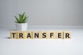 Transfer sign on a wooden table in a bright offce Royalty Free Stock Photo