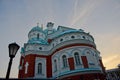 Transfiguration Cathedral on sunset background, view from below. The altar apse of the red brick cathedral with white crosses Royalty Free Stock Photo