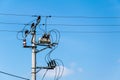 transformer on an electric pole on a background of blue sky Royalty Free Stock Photo