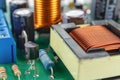 Transformer and electronic components installed on a printed circuit board closeup Royalty Free Stock Photo