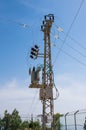 Electrical AC transformer on a pylon in Israel Royalty Free Stock Photo