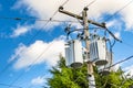 Electric Transformers at the Top of a Wooden Pole Royalty Free Stock Photo