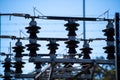 Transformers and insulators at a power electrical sub station Royalty Free Stock Photo