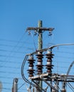 Transformers poles and insulators at a power electrical sub station Royalty Free Stock Photo