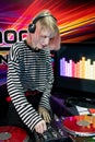 Transgender DJ sets up mixing equipment