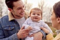 Transgender Family With Baby Enjoying Walk In Autumn Or Winter Countryside Royalty Free Stock Photo