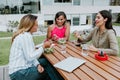 Transgender latin business woman middle age and colleagues eating salad at the office terrace in Mexico Latin America Royalty Free Stock Photo