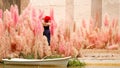 Woman walk in Fantasy Flower Dream Field with beautiful color