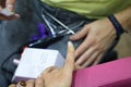 Transgender woman in the beauty salon and she is getting a manicure by the professional nail stylist. Beauty and health center.