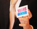 Transgender Word on card holding in hand. LGBTQ pride concept. Selective focus