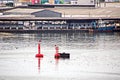 Transhipment terminal for discharging cement cargo by shore cranes. A view of berths with cargo ships and the water area of the po