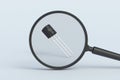 Transistor behind magnifying glass Royalty Free Stock Photo