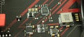 Transistors, chips and power components on motherboard of computer macro photo. Technology concept