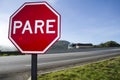 Red plate stop PARE transit sign