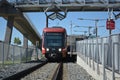 Transit train stopped at city station. Front view