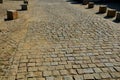 Transition of paved surfaces between paving and lawn. the lawn grows between individual randomly placed stones of granite chipped