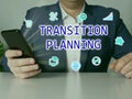 TRANSITION PLANNING text in search line. Businessman looking at smartphone