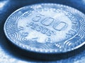 Translation: 500 Colombian pesos Republic of Colombia. Colombian coin 500 pesos closeup. Peso of Colombia. Blue tinted Royalty Free Stock Photo