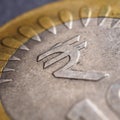 Translation of the inscription: rupee. Fragment of Indian 10 rupee coin with the sign of the national currency close up. Square