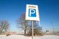 Translation from Lithuanian Zone or Area. Parking zone road sign covered by snow and icicles in a sunny frosty cold Royalty Free Stock Photo