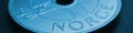 Translation: Norway. 1 Norwegian krone coin close up. National currency of Norway. Blue tinted money banner or header for news